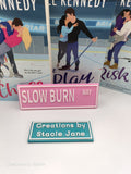 Slow burn way book shelf sign